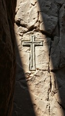 Stone Carving of Cross: A detailed carving of a cross on a rugged stone surface. The cross is illuminated by the light. The scene inspires a sense of history, religion, and reverence. 