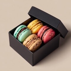 Four colorful macarons in a black gift box
