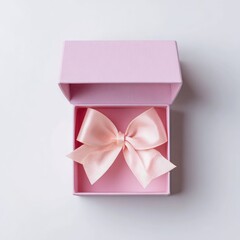 Open pink gift box with pale peach ribbon bow