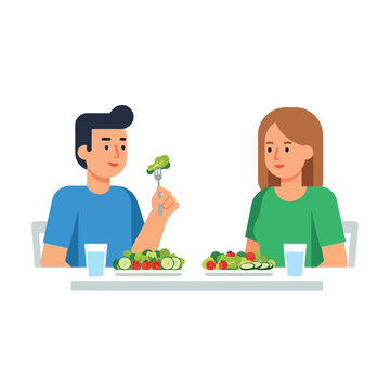 A man and a woman are sitting at a table eating salad, each with a glass of water.