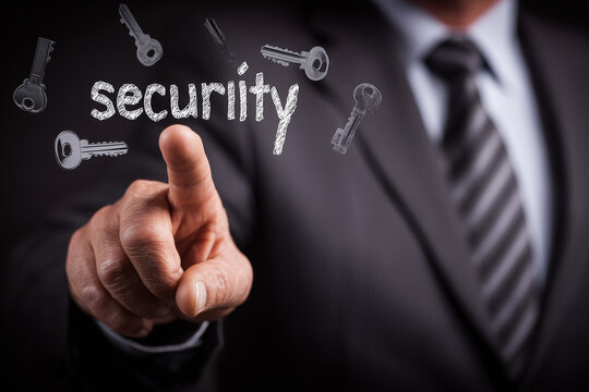 businessman touching on digital screen with words "security" with many keys flying around, a business concept banner design.