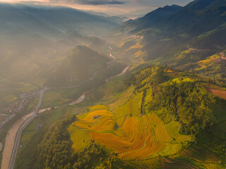 Aerial view of golden rice terraces in Kim Noi commune at Mu Cang Chai town near Sapa city, Vietnam. Beautiful terraced rice field in harvest season in Yen Bai province