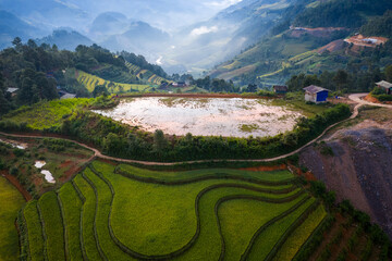 Aerial view of golden rice terraces in Kim Noi commune at Mu Cang Chai town near Sapa city,...