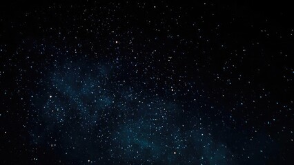 Naklejka premium Starry night sky with countless stars and a faint blue glow from interstellar dust. Concept Starry night sky, Countless stars, Blue glow from interstellar dust, Night sky photography