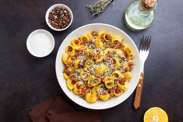Pasta with bolognese sauce and cheese. Italian cuisine. Traditional recipe.