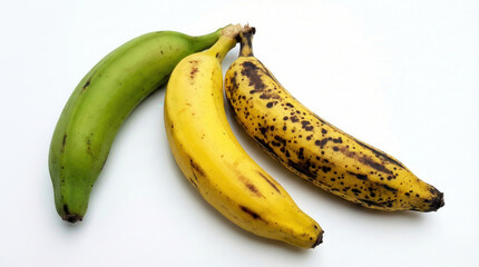 Three Bananas Showing Ripening Stages from Green to Yellow and Spotted Brown