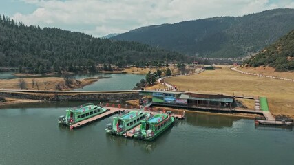 Potatso National Park fly over drone footage with Shudu lake and forest in Shangri-La Yunnan China