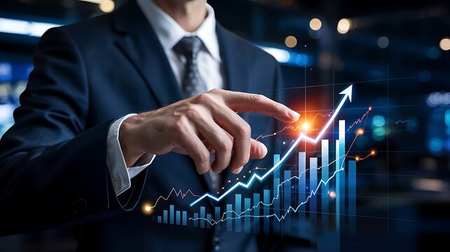 Businessman pointing at a glowing upward trending financial stock market graph with bar charts and data visualizations
