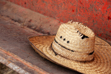 Naklejka premium Harvest workers hat in bucket of a tractor during fall grape harvest