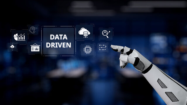 A robotic arm points at a virtual data driven interface in a sleek environment, highlighting icons related to technology and analytics, representing innovation and automation. Synapse - Powered by Adobe