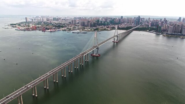 Zhanjiang Bay Bridge Aerial View with City Skyline and Waterfront Development in China