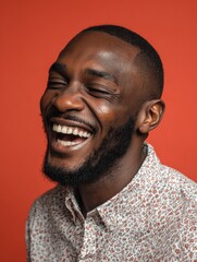Fototapeta premium handsome unshaven young darkskinned male laughing out loud at funny meme he found on internet smiling broadly showing his white straight teeth positive human facial expressions and emotions no logos 