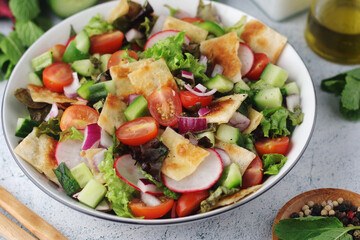 A bowl with Fattoush - Traditional Levantine salad