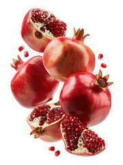Fresh pomegranates and seeds falling and splashing in mid-air isolated on transparent background