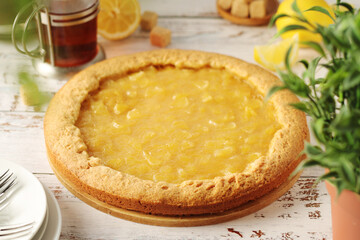 A tart with lemon marmalade served on the table