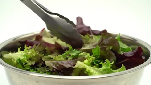 Fresh Salad Preparation: Mixing and Tossing Salad Greens in Stainless Steel Bowls, Healthy Food