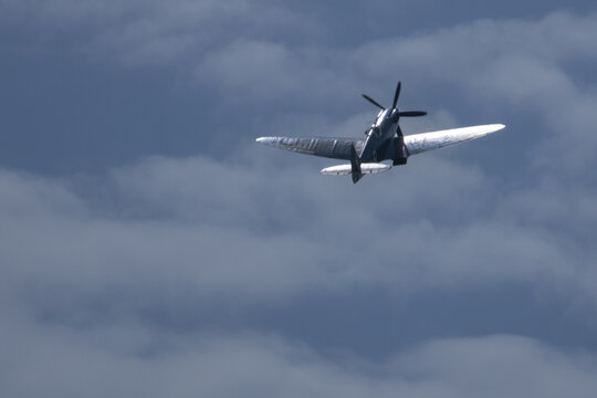 Spitfire plane in flight on sunny day. High quality photo