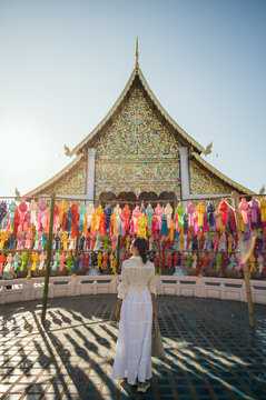 Woman at the temple with paper lanterns, Wat Chedi Luang, Chiang Mai, Thailand