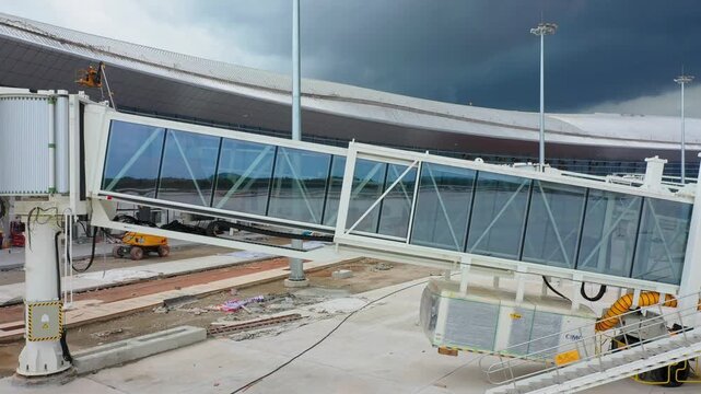 Airport Jet Bridge Construction at Wuchuan Zhanjiang with Protective Wraps and Equipment