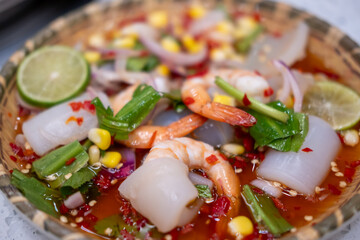 Seafood spicy salad served on plate. Thai food