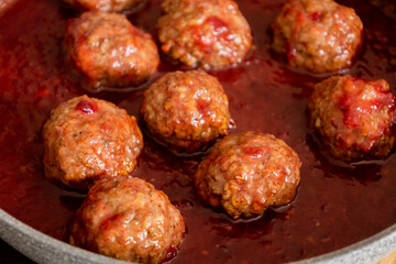 turkey meatballs with cranberry sauce in pan