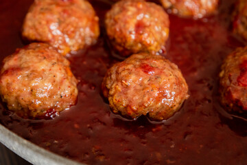 turkey meatballs with cranberry sauce in pan
