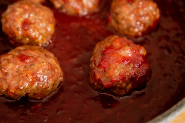turkey meatballs with cranberry sauce in pan