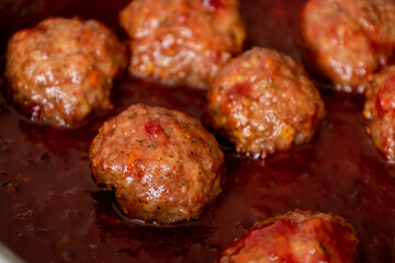 turkey meatballs with cranberry sauce in pan