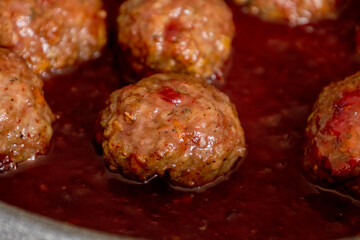 turkey meatballs with cranberry sauce in pan