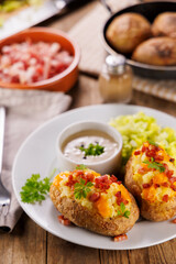 baked stuffed potato with crea, cheese and bacon