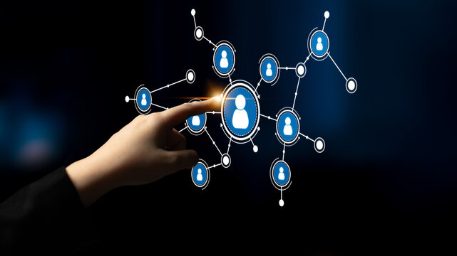 A human hand interacts with a digital network of user icons, representing social media and online connections in a modern, abstract setting. Perfect for tech themes. Tessel