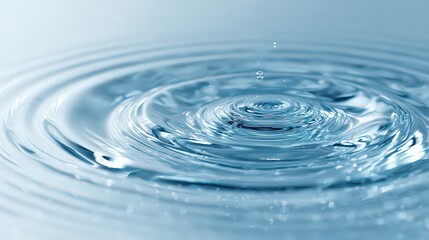 Close Up of Water Surface with Ripple Effect in Blue Tones Showing Circular Waves and Reflections with a Clean and Minimalist Aesthetic