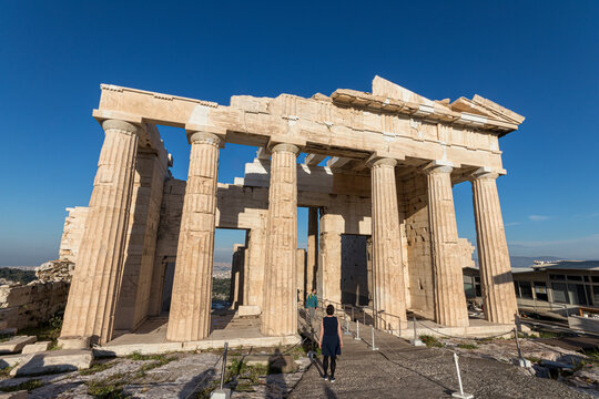 Athens, Greece. Eastern porch of the Propylaea on the Acropolis with tourists walking beneath the marble Doric columns of the 5th century BC gateway