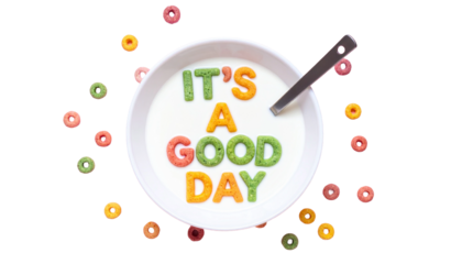 Colorful Cereal Spelling "It's a Good Day" script in Milk Bowl on a pastel pink background