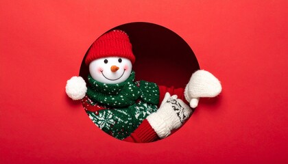 Festive snowman peeking through red cutout