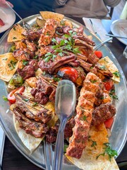 Large Platter of Mixed Grilled Meats, Kebab, Beef, Chicken and Lamb Chops Served with Rice and Flatbread