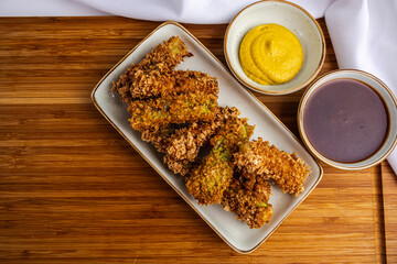 zucchini sticks fried in a deep fryer