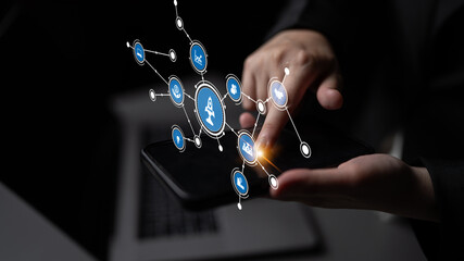 A hand interacts with a smartphone showcasing digital icons, illustrating technology integration in daily life, communication, and modern connections through devices. Tessel