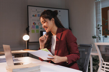 Young asian businesswoman smiling during online video call