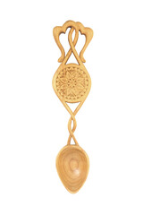 Welsh love spoon on white background. Token of love and affection, traditional floral romantic celtic gift for reciprocated love with two hearts. Sycamore wood.