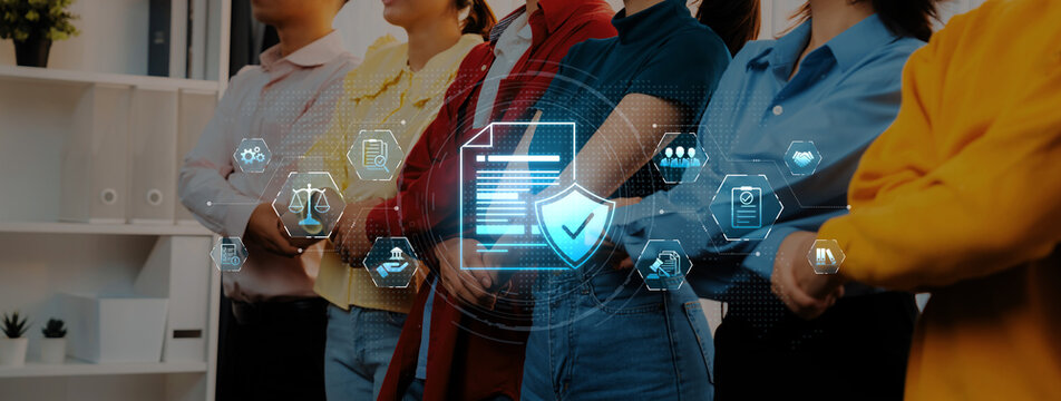 Group of diverse professionals standing together in an office environment, symbolizing teamwork and collaboration, with digital icons representing security and innovation. Trope