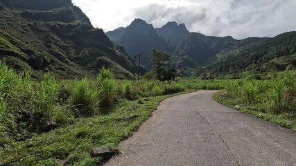 POV motorbike ride on the Ha Giang Loop, Northern Vietnam. Winding roads, misty mountains, and remote villages create an immersive adventure for motorbike and travel lovers.