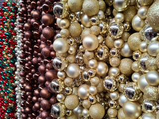Christmas baubles wall in the colors gold, brown, red and green
