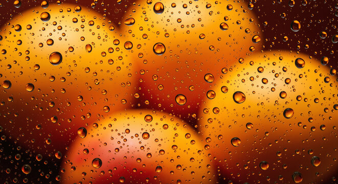 Vibrant orange apricots behind wet glass with water drops, creating a fresh abstract background. - Powered by Adobe