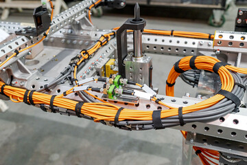 Automotive robotic system cables managing industrial automation connectivity