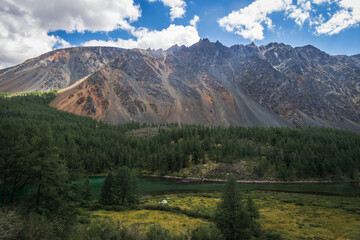 stone mountains with lake near the Siberian forest