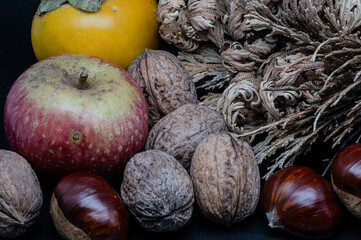 Still life of four typical autumn fruits