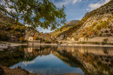 Fototapeta premium Lake San Domenico is an artificial lake in Abruzzo, in the municipality of Villalago (L'Aquila). Known for its emerald waters, it is located within the Sagittario Gorges.