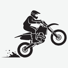 Silhouette of a Motocross Rider Performing a Wheelie on a Dirt Bike