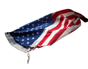 Torn American flag on the grey dusty ground